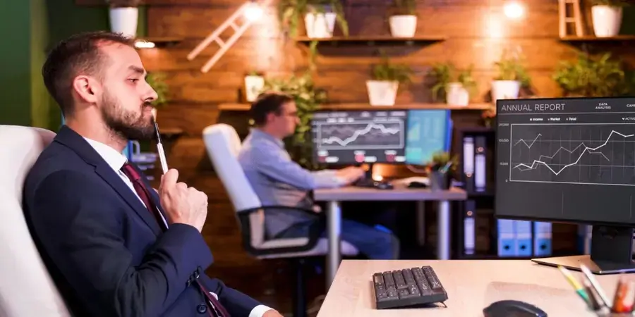Trader at multi-monitor forex desk analyzing charts with prop firm funding icons and profit-sharing graphs. Trader at multi-monitor forex desk analyzing charts with prop firm funding icons and profit-sharing graphs.